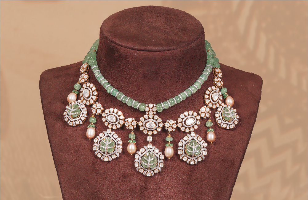 Diamond and green bead necklace on display bust